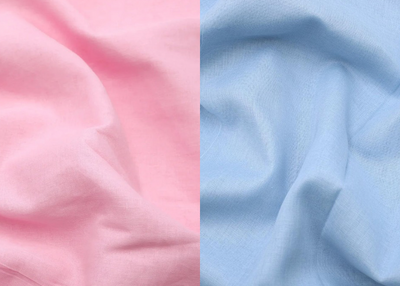 Two swatches of fabric, one pink and one blue, side by side.