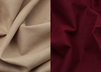 Close-up of beige fabric on the left and red fabric on the right.